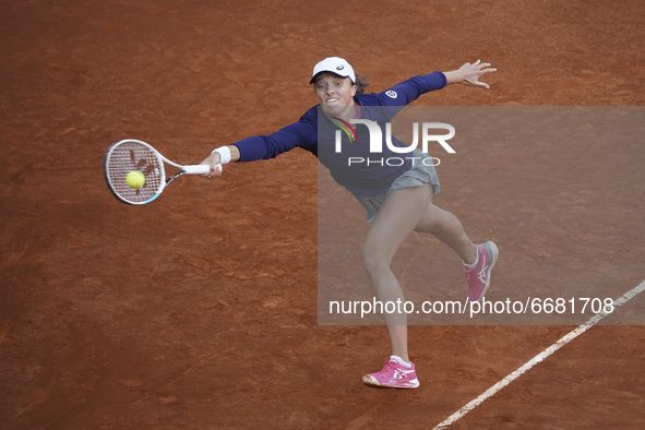 Iga Swiatek of Poland in action during her match against Ashleigh Barty of Australia at La Caja Magica on May 03, 2021 in Madrid, Spain. 