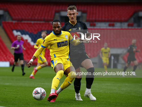 L-R Lamar Reynolds of Concord Rangers holds of Will Smith of Harrogate Town during  The 2019/2020 Buildbase FA Trophy Final between Concord...