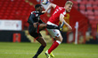  L-R TJ Eyoma of Lincoln City (on loan from Tottenham Hotspur) tussle with Charlton Athlet...