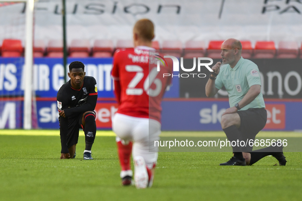  Tayo Edun of Lincoln City takes the knee before the Sky Bet League 1 match between Charlton Athletic and Lincoln City at The Valley, London...