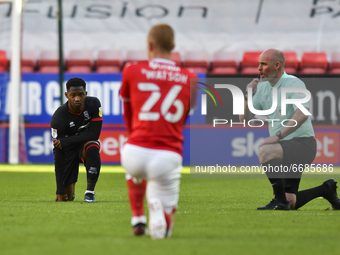  Tayo Edun of Lincoln City takes the knee before the Sky Bet League 1 match between Charlton Athletic and Lincoln City at The Valley, London...