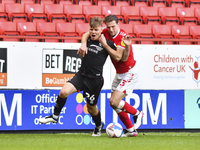  Ben Purrington of Charlton Athletic battles for possession with Harry Anderson of Lincoln City during the Sky Bet League 1 match between Ch...
