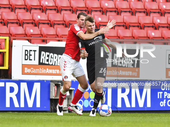  Ben Purrington of Charlton Athletic battles for possession with Harry Anderson of Lincoln City during the Sky Bet League 1 match between Ch...