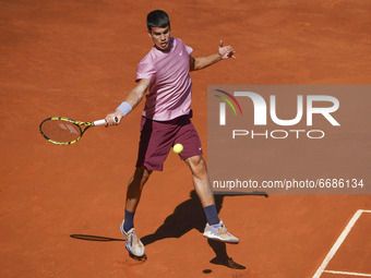 Carlos Alcaraz of Spain in action  during his second round match against Rafael Nadal of Spain during day seven of the Mutua Madrid Open at...