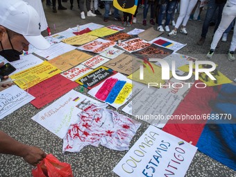 Posters are seen on the ground
About 400 people, mostly from the Colombian community of Barcelona, have demonstrated one more day in support...