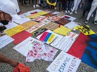 Posters are seen on the ground
About 400 people, mostly from the Colombian community of Barcelona, have demonstrated one more day in support...