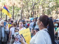 Protester is seen speaking into microphone for protesters.
About 400 people, mostly from the Colombian community of Barcelona, have demonstr...