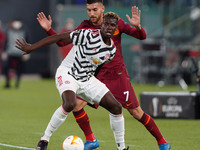 Paul Pogba of Manchester United and Lorenzo Pellegrini of AS Roma compete for the ball during the UEFA Europa League Semi-Final match betwee...