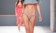 A model showcases a clothes of 'Swimwear over the rainbow'', a new collection Spring - Sum...