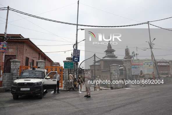 Indian police forces stand outside Kashmir's grand mosque during Covid-19 lockdown on the last friday of Ramadan in Srinagar, Indian Adminis...