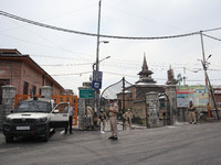 Indian police forces stand outside Kashmir's grand mosque during Covid-19 lockdown on the last friday of Ramadan in Srinagar, Indian Adminis...