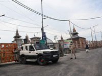 Indian police forces walk outside Kashmir's grand mosque during Covid-19 lockdown on the last friday of Ramadan in Srinagar, Indian Administ...