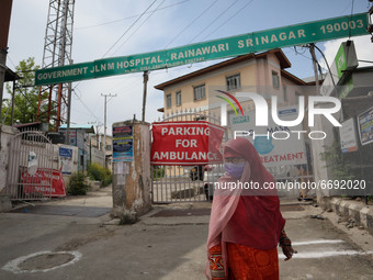 A woman walks outside a hospital during Covid-19 lockdown on the last friday of Ramadan in Srinagar, Indian Administered Kashmir on 07 May 2...
