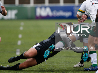    George McGuigan of Newcastle Falcons tackles Rob Simmons during the Gallagher Premiership match between Newcastle Falcons and London Iris...