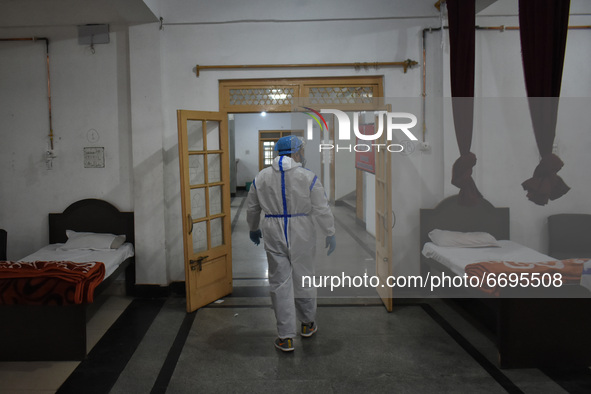 A Health worker inspects beds at a temporary Covid-19 hospital in Srinagar, Indian Administered Kashmir on 08 May 2021. A Local NGO Athrout...