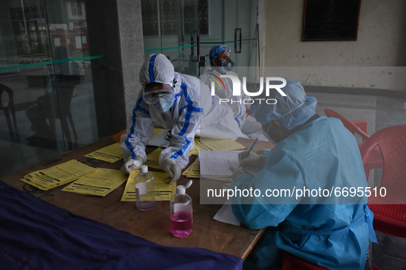 Health workers prepare prescriptions at a temporary Covid-19 hospital in Srinagar, Indian Administered Kashmir on 08 May 2021. A Local NGO A...