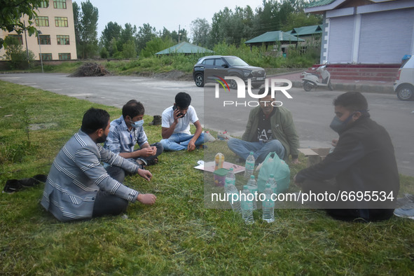 Health workers wait to break fast during ramadan outside a temporary Covid-19 hospital in Srinagar, Indian Administered Kashmir on 08 May 20...