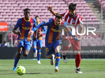 Leo Messi and Lucas Torreira during the match between FC Barcelona and Club Atletico Madrid, corresponding to the week 35 of the Liga Santan...