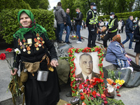 Elderly woman  near the Tomb of the Unknown Soldier as she marks the Victory Day, the 76th anniversary of the victory over Nazi Germany in W...