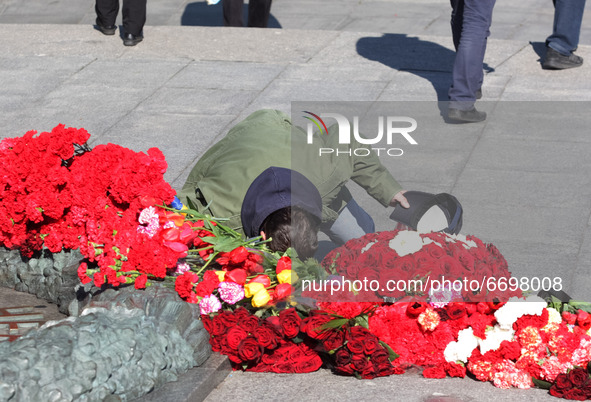A man bows in front of the Monument of Eternal Glory on the Tomb of the Unknown Soldier, during the Victory Day celebration amid the Covid-1...