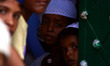 indian muslim boys peeps out from a window of a mosque during holy month of Ramadan,at Gau...