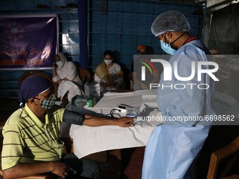 A present  check oxygen saturation   a  Health Camp amid Covid-19 pandemic  in Kolkata on May 09,2021. (