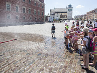 In Warsaw on castle square set a water curtain, so that everyone can cool off on hot days, on July 3, 2015, in Warsaw, Poland. (