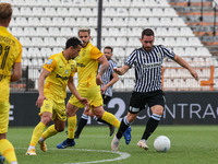 Andrija Živković #14 of PAOK and Cristian Ganea #22 of Aris in action with the ball during the soccer match between PAOK v Aris for the Play...