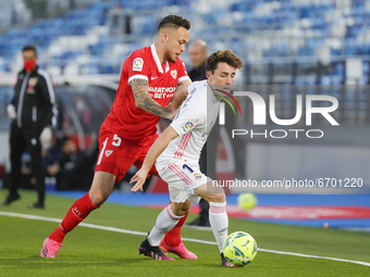 Alvaro Odriozola of Real Madrid in action with Lucas Ocampos of Sevilla CF during the Spanish Liga Santander match between Real Madrid and S...