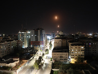 Rockets are launched from the Gaza Strip towards Israel, Tuesday, May. 11, 2021. The barrage of rockets from the Gaza Strip and airstrikes i...