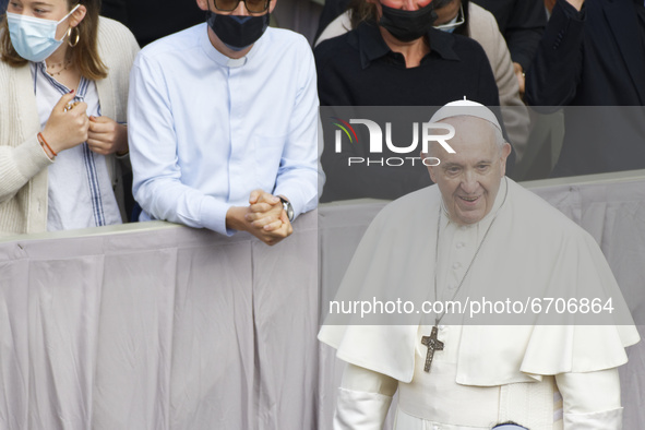 Pope Francis attends in the St. Damaso Courtyard at the Vatican for his weekly general audience, Wednesday, May 12, 2021.  