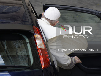 Pope Francis gets in car as he leaves the St. Damaso Courtyard at the Vatican at the end of his weekly general audience, Wednesday, May 12,...