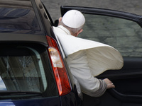 Pope Francis gets in car as he leaves the St. Damaso Courtyard at the Vatican at the end of his weekly general audience, Wednesday, May 12,...