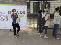 Adults between 50 and 59 years of age went to the Benito Juarez Elementary School in Cuauhtemoc, Mexico City, to receive the first dose of t...