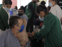 Adults between 50 and 59 years of age went to the Benito Juarez Elementary School in the Cuauhtemoc district to receive the first dose of th...