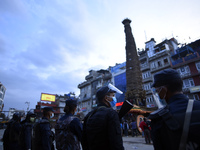 Nepalese Police guard around the chariot during procession of Rato Machindranath towards the chariot on the first day of the longest chariot...