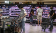 People wearing face masks browse goods inside a shopping mall in Hong Kong, Thursday, May...