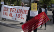 People take part in a demonstration organized from the Paseo del Prado to the Congress of...
