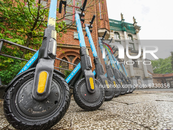 Electric kickscooters belonging to the LOGO SHARING  scooters sharing company parkedin the city center are seen in Gdansk, Poland on 17 May...