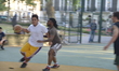 People participating in an amateur game of basketball, on Argyll Park's basketball courts,...
