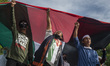 Protesters parade a 15 meter long Palestinian flag while staging a solidarity demonstratio...