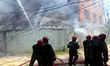 Firefighters try to extinguish a fire in a high-rise building at Kakrail in Dhaka, Banglad...