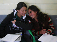 Two teenage women from a primary school in Mexico take classes during the back-to-school period to continue their studies in Mexico City, Me...