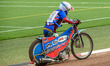 Cameron Taylor pushes his bike back to the pits during the British Junior Championship at...
