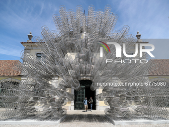 People walk by Chinese artist Ai Weiwei sculpture "Forever Bicycles" during a press preview of his new exhibition 'Rapture'  at the Cordoari...