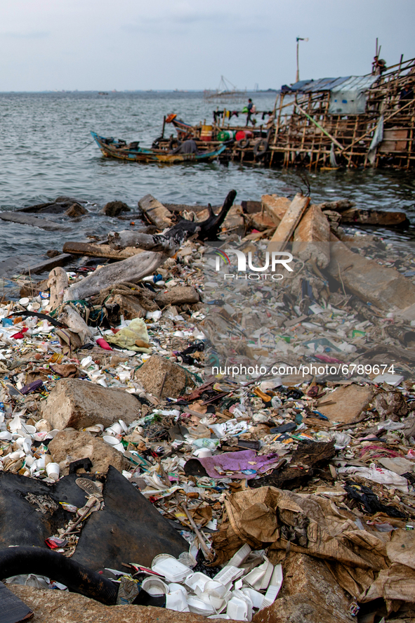 Plastic and Styrofoam litter the shore in the North of Indonesia capital Jakarta on 8 June 2021. As people around the world mark World Ocean...