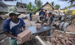 Workes finish making bricks using machines in Palembang, Thursday, June 10, 2021. The prin...