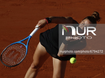 Greece's Maria Sakkari returns the ball to Czech Republic's Barbora Krejcikova during their women's singles semi-final tennis match on Day 1...