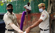 Delhi Police personnel detain an artist along with congress party workers participating in...