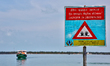 Warning sign about the danger of drowning at Kurikadduwan harbour in the Jaffna region of...